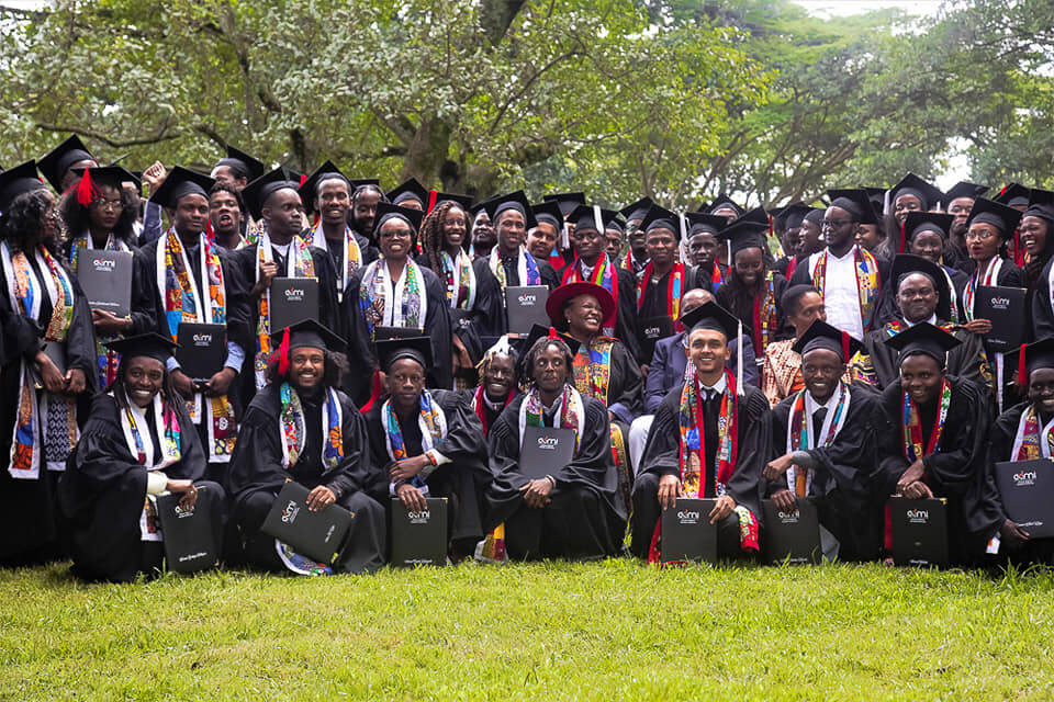ADMI students posing for a picture after graduating