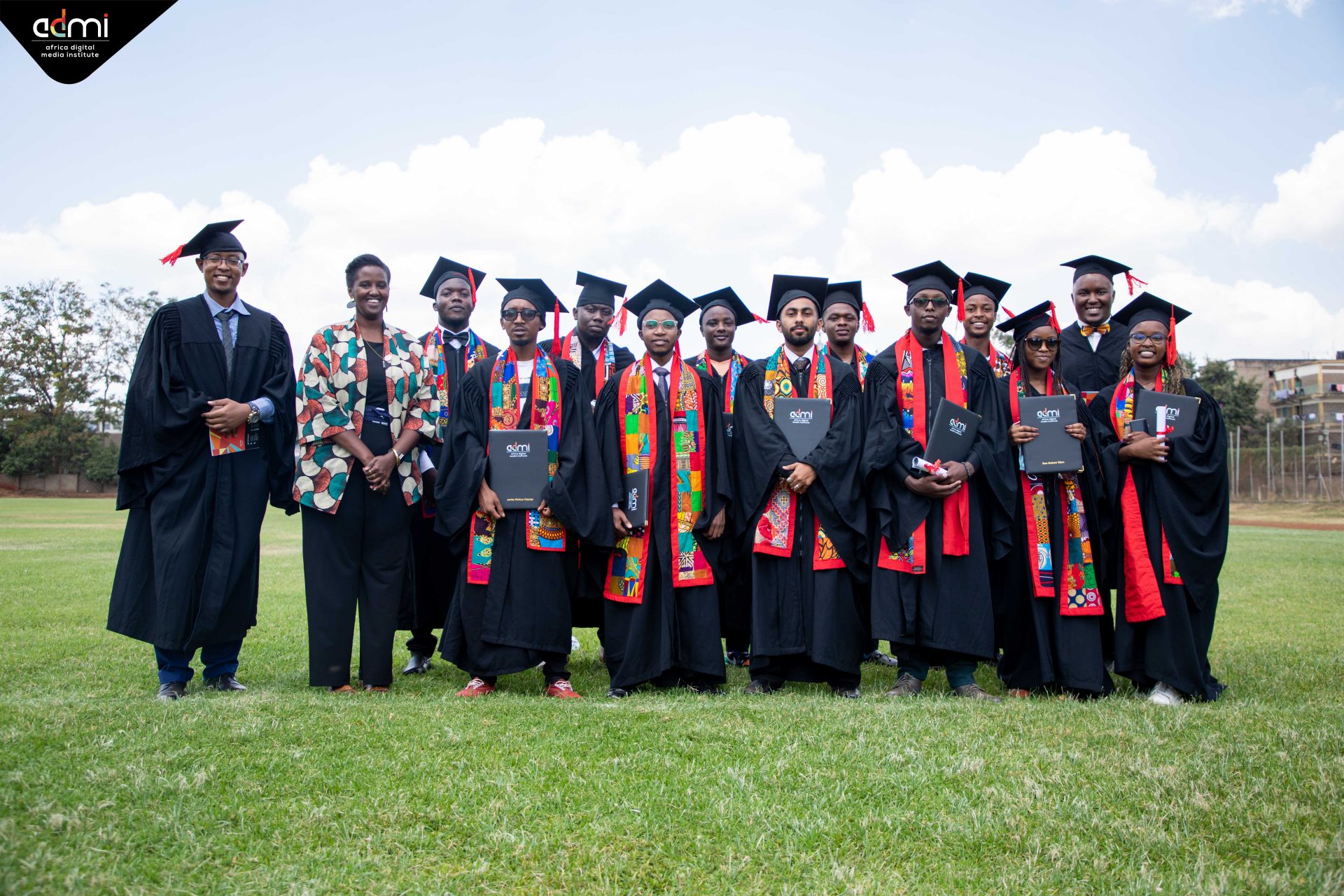 Graphic design students posing for a picture at the graduation ceremony