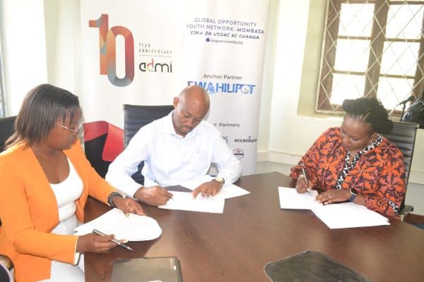 ADMI CEO Laila Macharia sign an MOU with CEO of Swahili pot and a representative from GYON in Mombasa