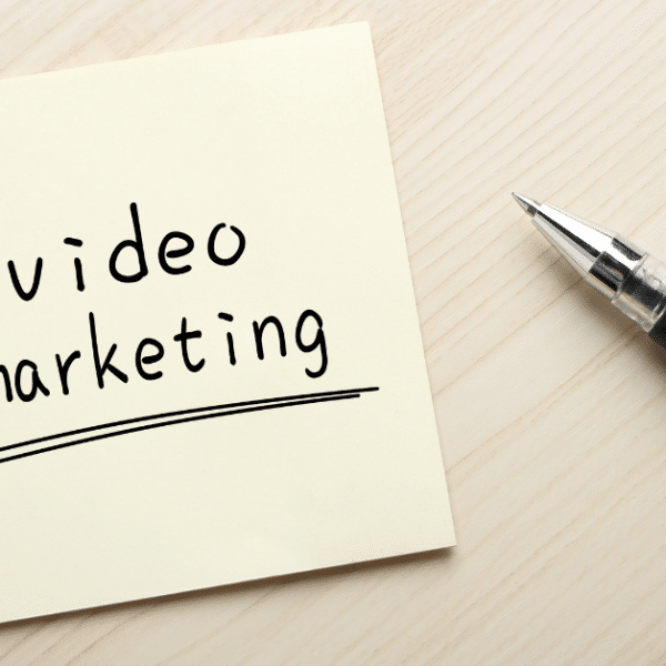 Text video marketing written on a yellow sticky note